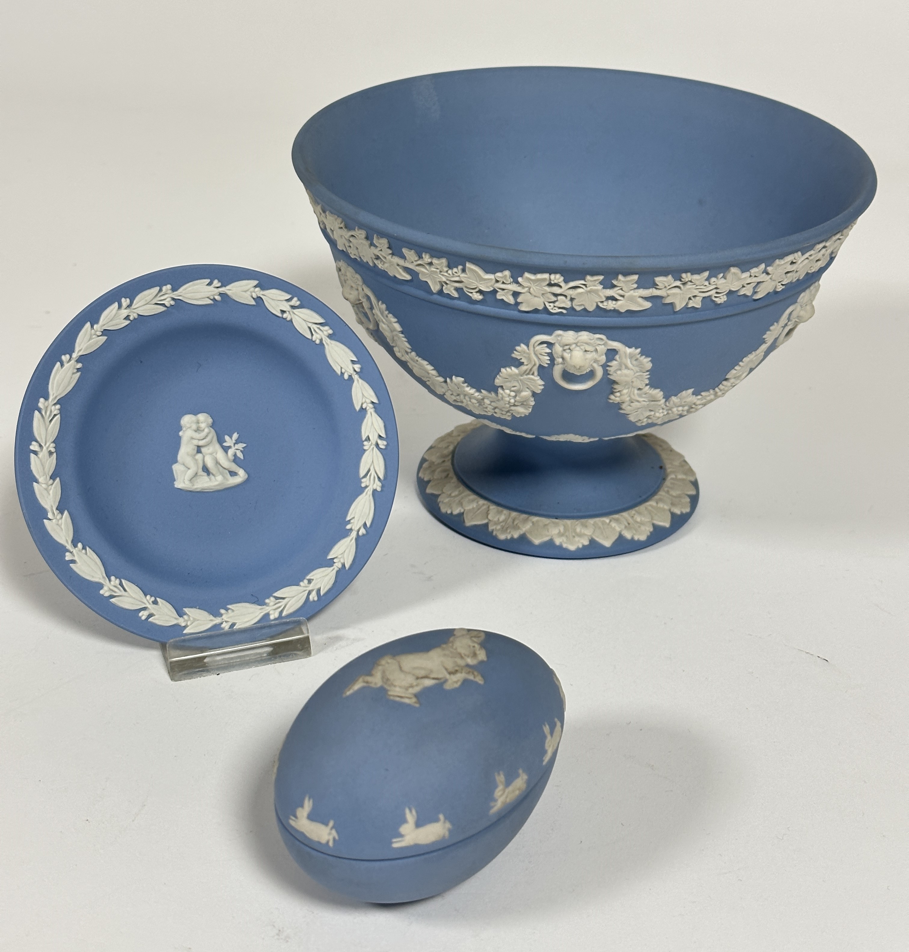 A Wedgwood pale blue jasper-ware rose bowl with classical lion ring masks joined with vine leaves