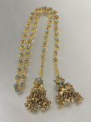 A Indian style gilt metal floral chain link open tassel necklace with inset turquoise ceramic