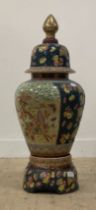 A Chinese porcelain baluster vase and cover on stand, decorated in polychrome enamels with floral