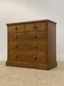 A Victorian ash chest, fitted with two short and three long drawers flanked by canted corners,