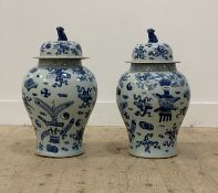 A pair of Chinese blue and white porcelain baluster vase and covers, each decorated auspicious
