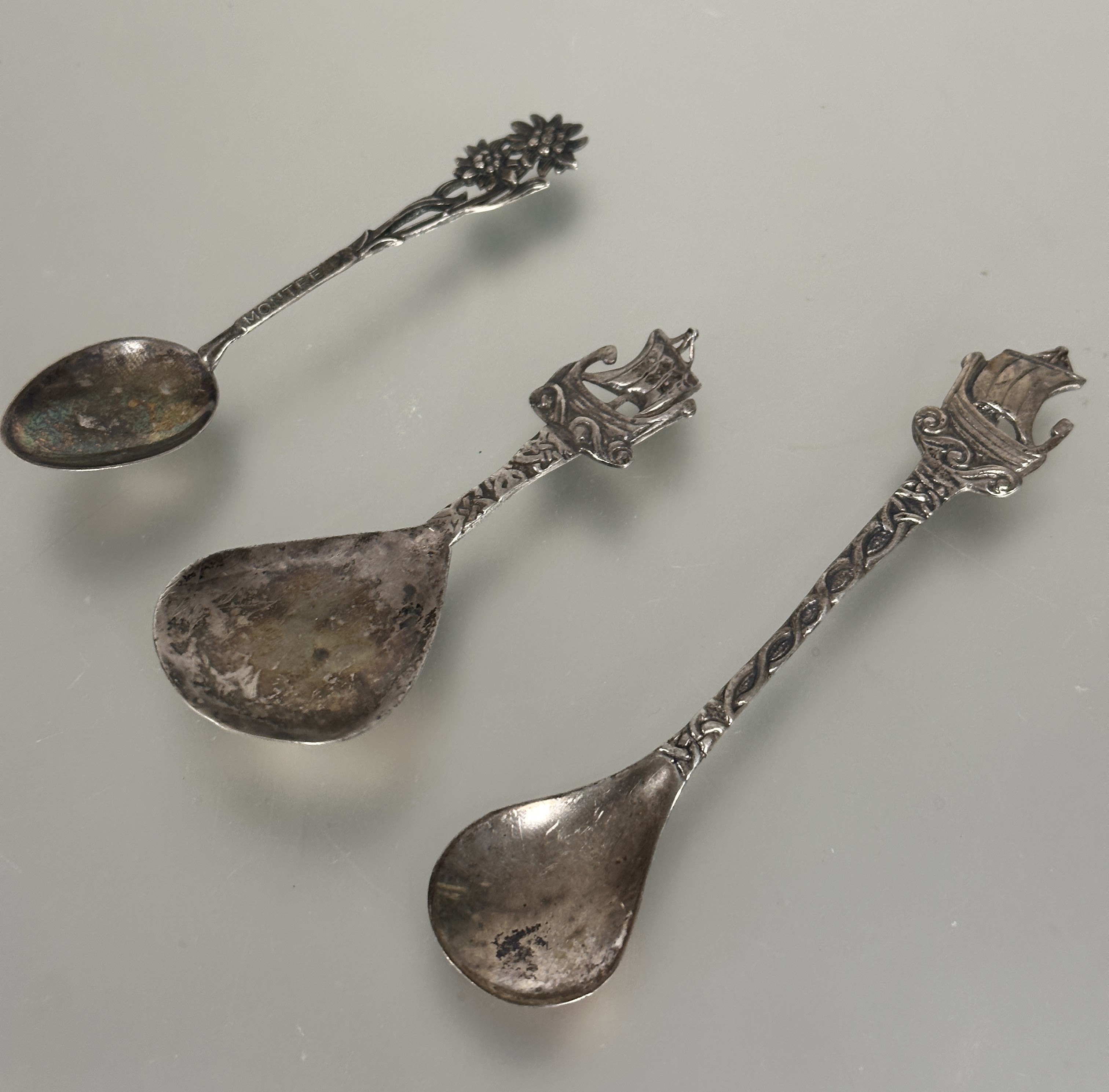 A  Robert Allison early Glasgow silver Viking Longboat tea spoon with Celtic knot stem, (L  x 12