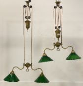Christopher Wray, a pair of gilt brass twin branch rise and fall pendent lights, complete with