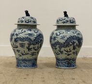 A pair of Chinese blue and white porcelain baluster vase and covers, each decorated with four toe