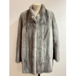 A Lady's silver Mink fur jacket with Nehru collar and satin lining with embroidered initials VEB,