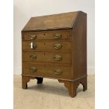 An Edwardian inlaid mahogany bureau, the fall front opening to a fitted interior, above four