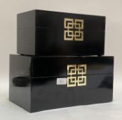 A graduated pair of Chinse style black lacquered and brass mounted jewellery boxes W34cm.