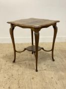 A late Victorian oak centre table, the square serpentine top with moulded edge raised on cabriole