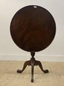 A Georgian style mahogany snap top table, the dished circular top raised on a turned column and