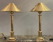 A pair of well cast gilt brass table lamps formed as classical columns, complete with conical