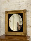 A 19th century and later gilt composition and gesso famed wall hanging mirror 107cm x 94cm.