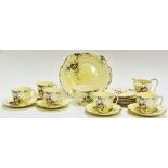 A Royal Staffordshire gilt part tea service with floral decoration comprising five cups, six saucers
