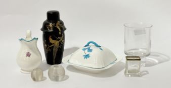 A porcelain pitcher with DLA initials to the front with blue and red rim decoration (h-16cm), a