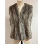 A silver Mink gilet with satin lining and Dominion Fur Company lebel, shows no signs of moth, splits