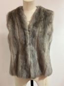 A silver Mink gilet with satin lining and Dominion Fur Company lebel, shows no signs of moth, splits