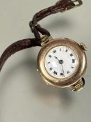 A Vintage 1930s lady's 9ct gold cased wristwatch with white enamel dial and roman numerals on