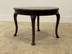 An early 20th century stained oak low table, the circular top raised on cabriole supports with pad