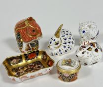 A collection of four Royal Crown Derby china paperweight figures including a Red Squirrel, a Bunny