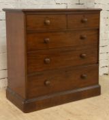 A Victorian mahogany chest, fitted with two short and three long drawers, raised on a plinth base.