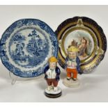 A 19thc Turner china transfer printed blue and white plate decorated with two men on a bridge