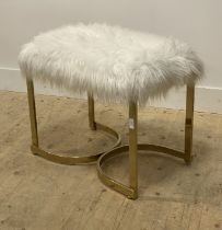 A contemporary vanity stool, with faux sheepskin upholstered seat raised on gilt box section