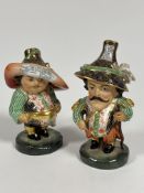 A set of two Royal Crown Derby Mansion House figures, decorated in traditional Crown Derby style