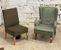 A mid 20th century wingback armchair, upholstered in green damask, raised on tapered supports, (