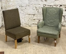 A mid 20th century wingback armchair, upholstered in green damask, raised on tapered supports, (