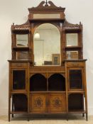 A late Victorian / Edwardian walnut dresser, the raised back with sectional mirror panels and open