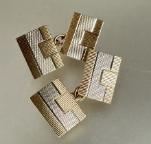 A pair of Art Deco 9ct white and yellow gold sleeve links of rectangular shape with engine turned