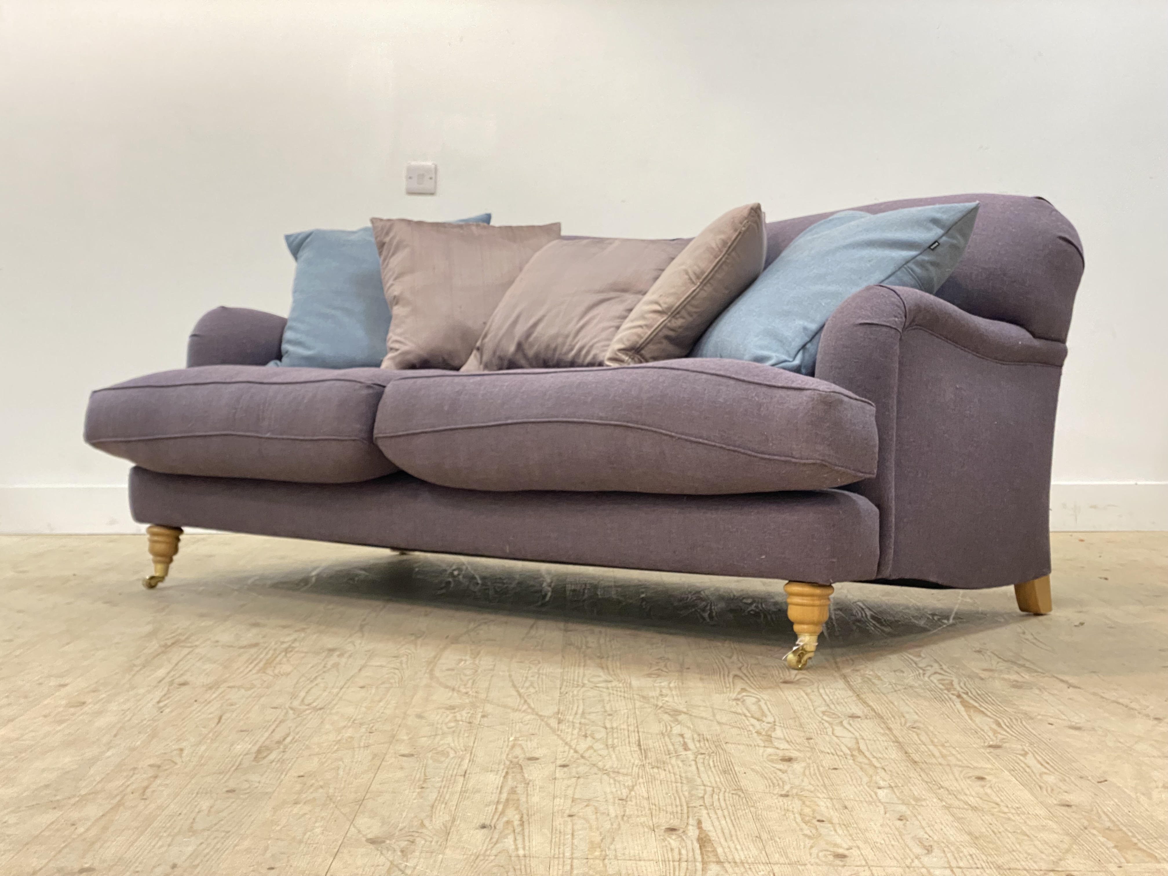 Charlotte James for Anta, a traditional 'Howard style' two seat sofa, the frame and deep squab
