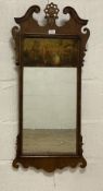 A parcel gilt walnut fretwork mirror of 18th century design, the swan neck pediment centred with