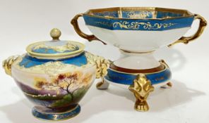 A twin-handled octagonal Noritake porcelain stemmed bowl and stand painted with lake scene landscape