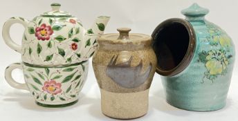 A mixed group of ceramics comprising a Guernsey Potter salt pig with floral sprays on a blue