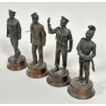 A set of four bronzed finished resin cast military figures raised on circular wood bases, (H x 26