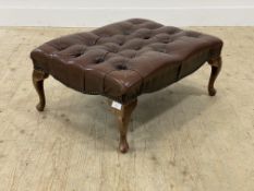 A Vintage foot stool, upholstered in deep buttoned oxblood leather, raised on cabriole supports.