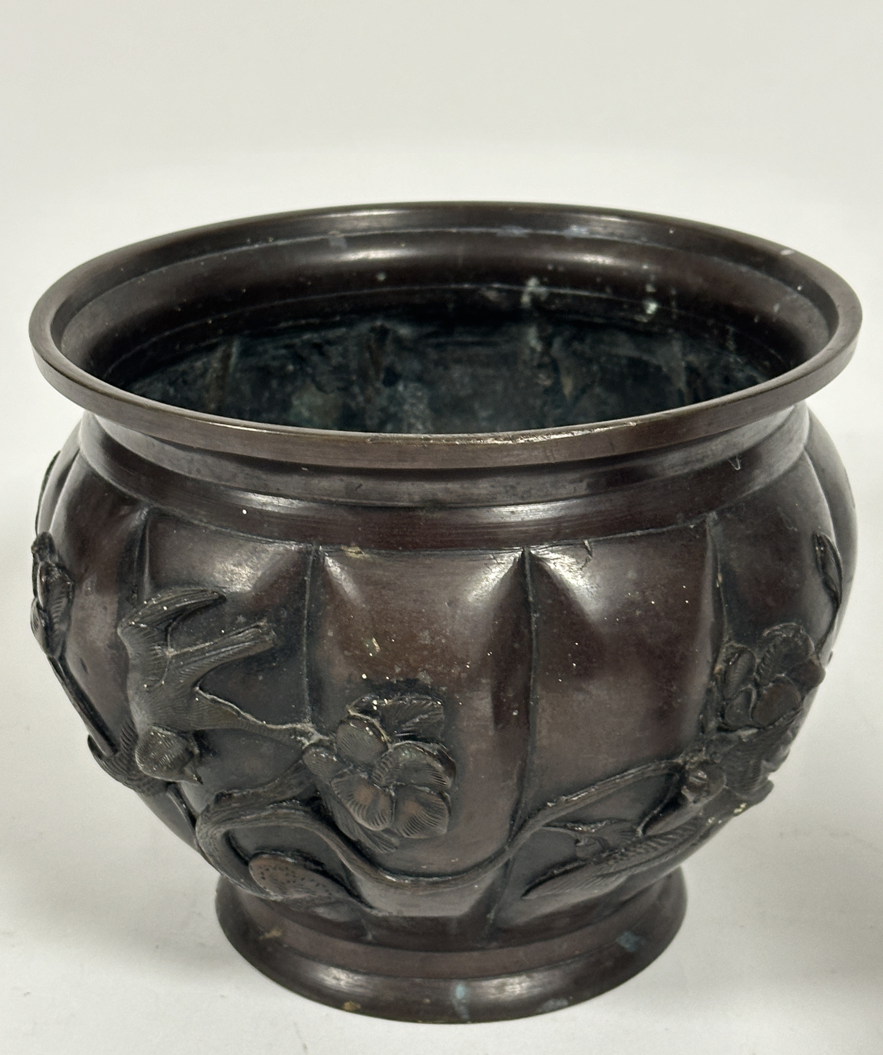 A Japanese patinated bronze jardiniere of paneled tapered design with cast bird and floral - Image 4 of 5
