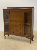 An early 20th century mahogany secretaire display cabinet, the ledge back above a fall front
