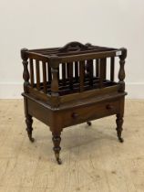 A mid 19th century mahogany Canterbury, the top with three divisions above a drawer to base,