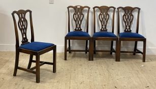 A set of four early 20th century mahogany dining chairs in the Georgian style, with splat backs over