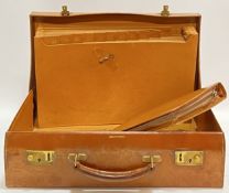 An early twentieth century Debenham and Freebody leather briefcase with documents compartment to