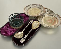 A Victorian pair of Epns gilt berry spoons with chased leaf and fruit design and open leaf handles