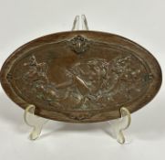 An Edwardian oval oak plaque mounted with copper relief panel depicting water nymphs, (L x 23.5 x