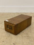 An early 20th century oak desk top single drawer index box or slide container, stencilled in gilt "