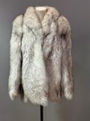 A 1980s lady's gray Fox fur jacket with Nero style collar, slash pockets and gray satin lining and