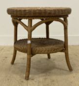 A Vintage rattan two tier circular lamp table. H55cm, D57cm.