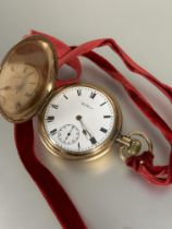 An American Watham full hunter gilt metal pocket watch with enamel dial, roman numerals and