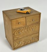 A pine miniature nest of drawers fitted two short and two long, (H x 24 cm x L x 21 cm x W x 16