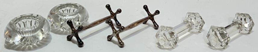 A pair of silver plated knife rests, together with a pair of cut glass knife rests and a pair of cut