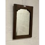 An 18th century and later wall hanging mirror in a pegged and jointed oak frame. 38cm x 57cm.